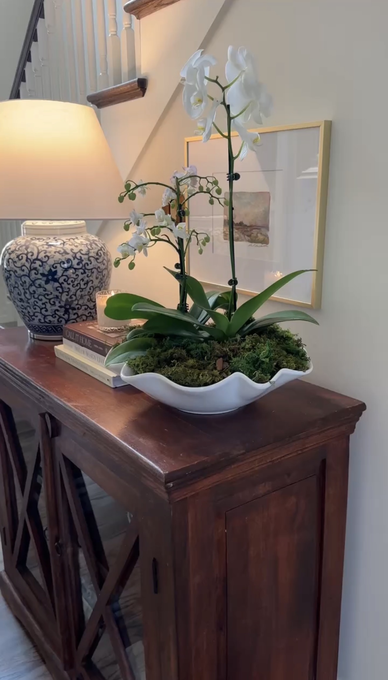 White orchid on a console table